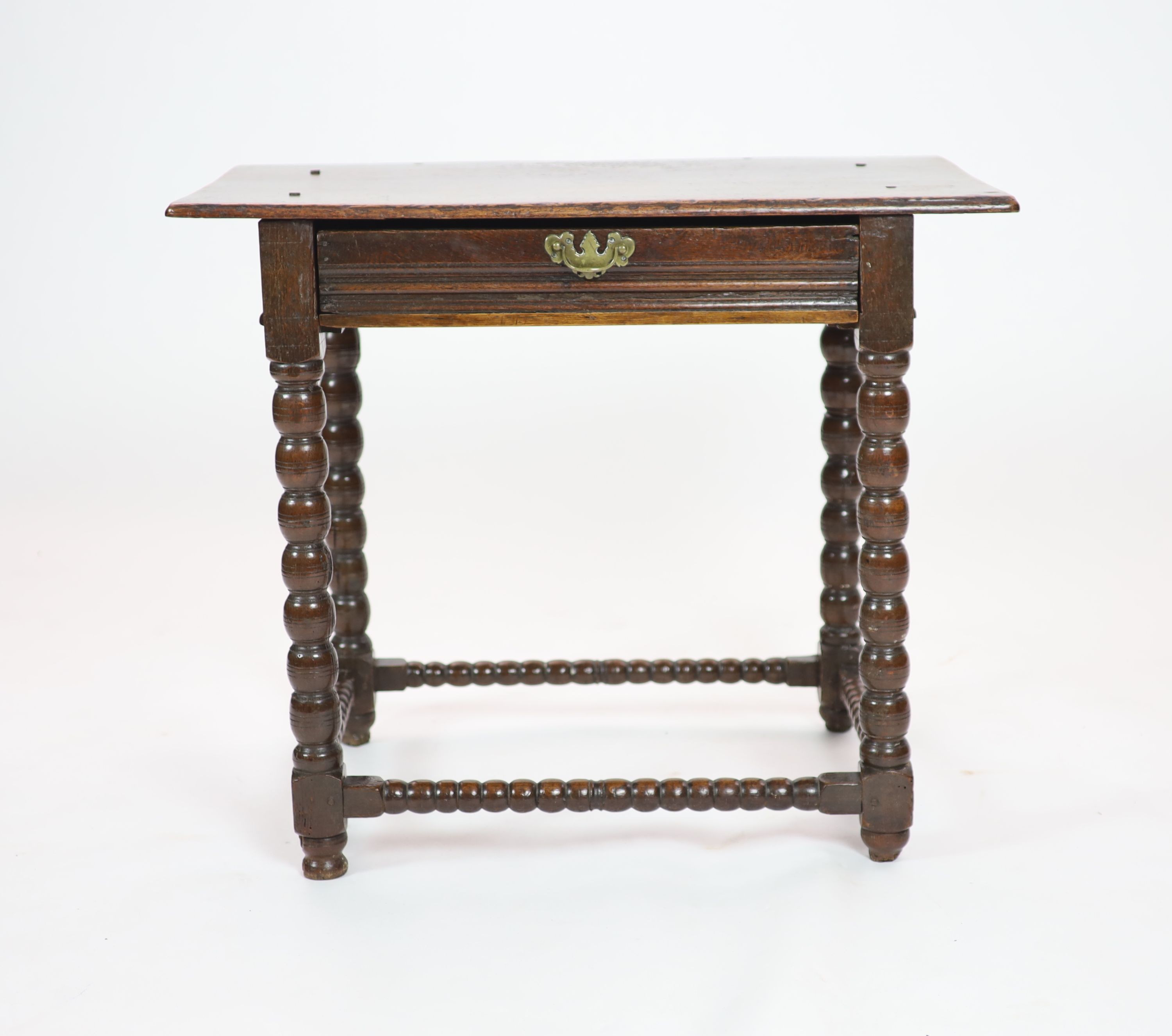 A Charles II rectangular oak side table H 76cm. W 89cm. D 54cm.